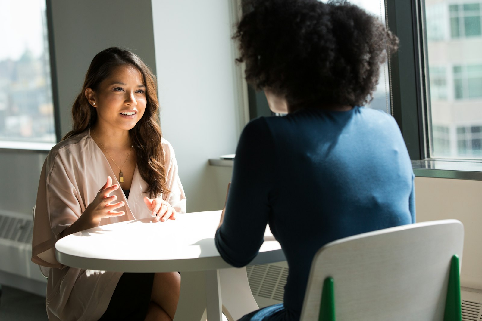 A warm conversation between Renewing Hope staff and a community member